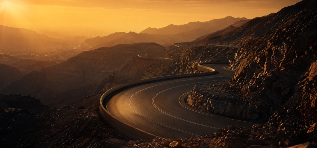 Luxury car on the Jebel Jais mountain road, one of Dubai's best scenic drives